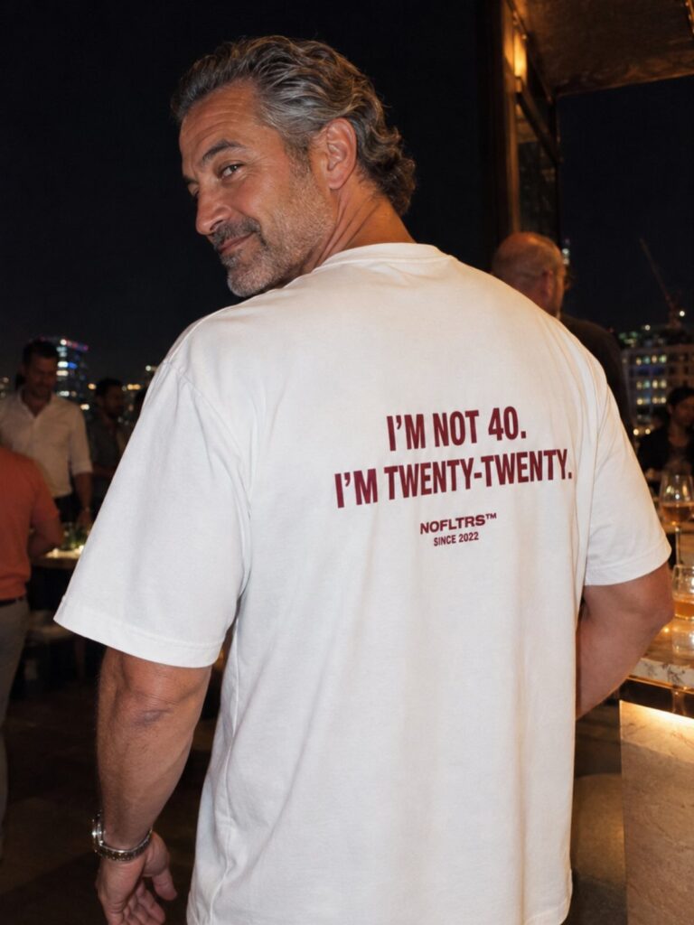 Man wearing a white t-shirt with 40th birthday text on the back