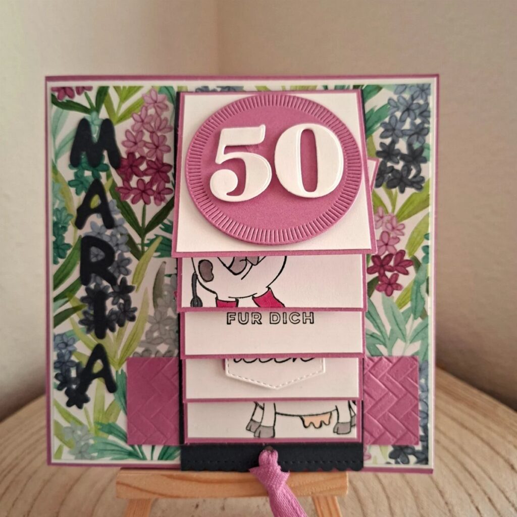 Handmade 50th birthday card with pink floral patterns and the number 50.