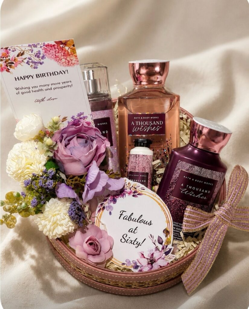 Gift basket with flowers, fragrances, and a Fabulous at Sixty sign for a birthday.