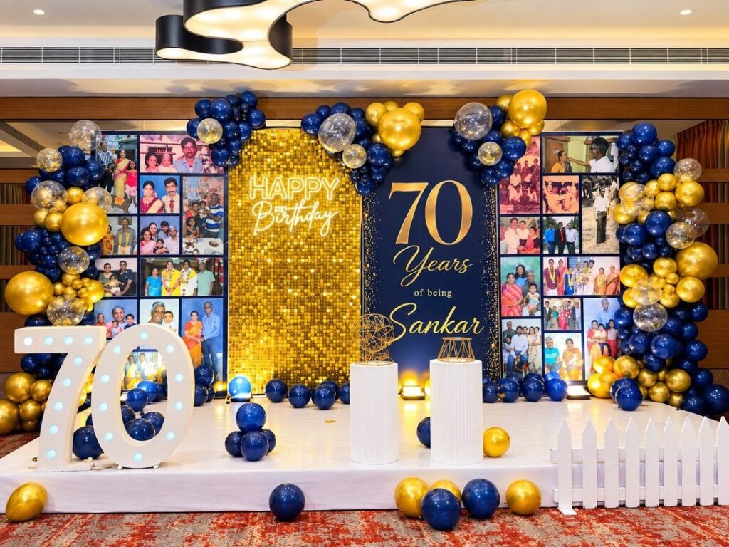 Birthday party decoration with gold and blue balloons, photo wall, and large 70 numbers